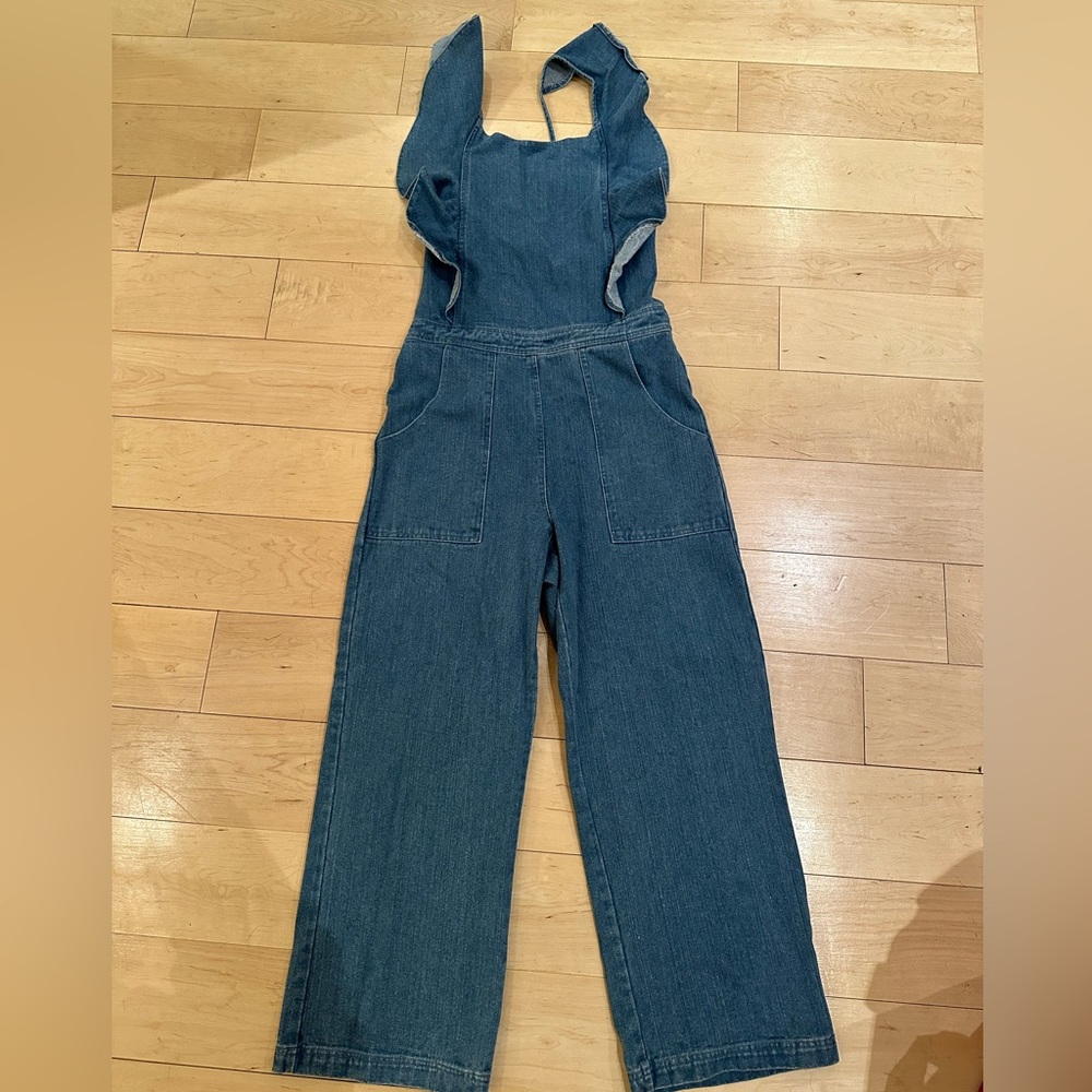 NWT so chic denim jumpsuit, backless w. Crossed back. Make an offer!!